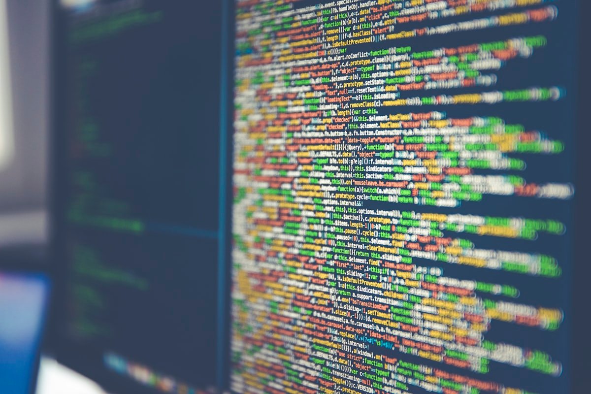 Lines of code filling a dark screen
